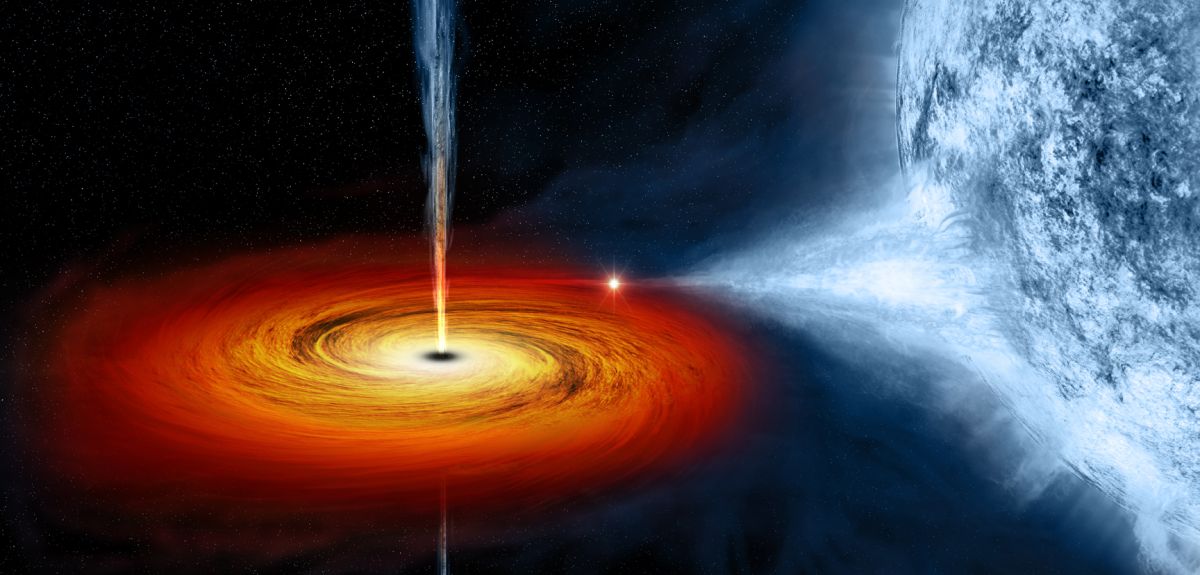 Artistic image showing matter being dragged from a star to form a spiral shaped rotating mass around a black hole. 