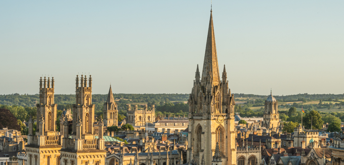 The Oxford skyline at sunset, showing All Souls College and the University Church in the foreground