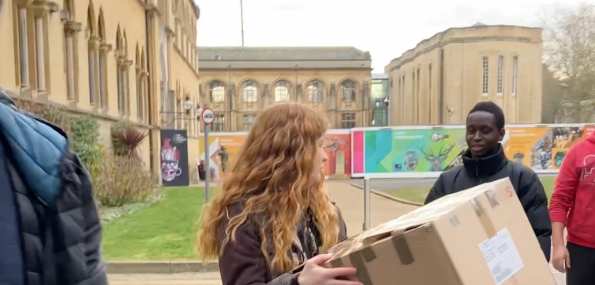 Oxford students moving boxes to transport to Turkey