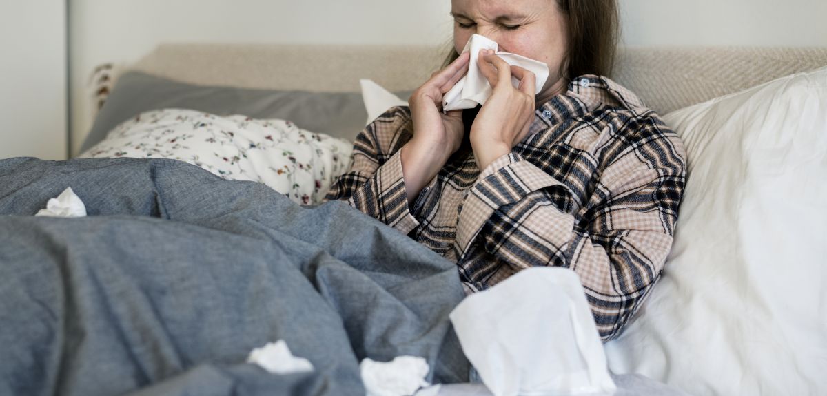 Sick student on bed with flu