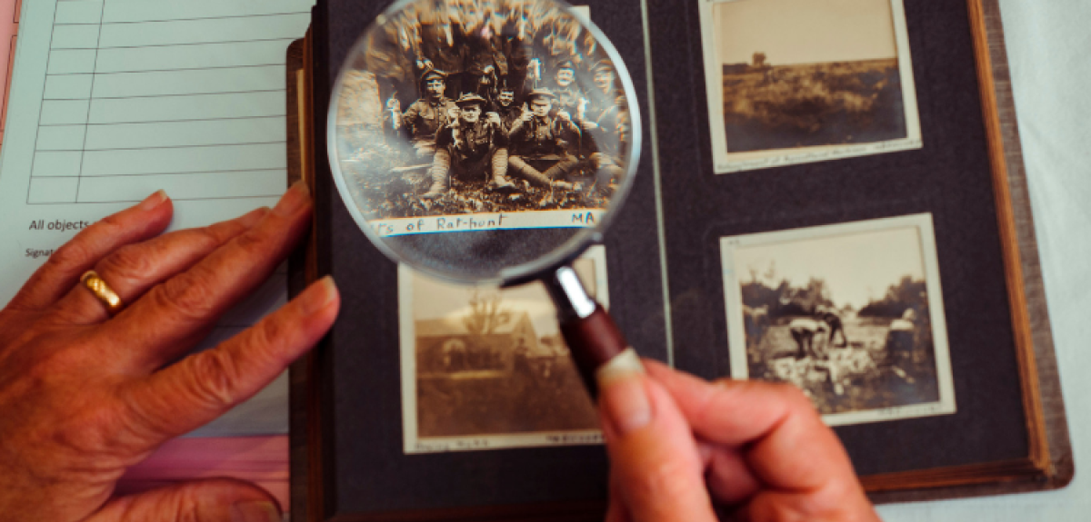 Photograph album with a magnifying glass