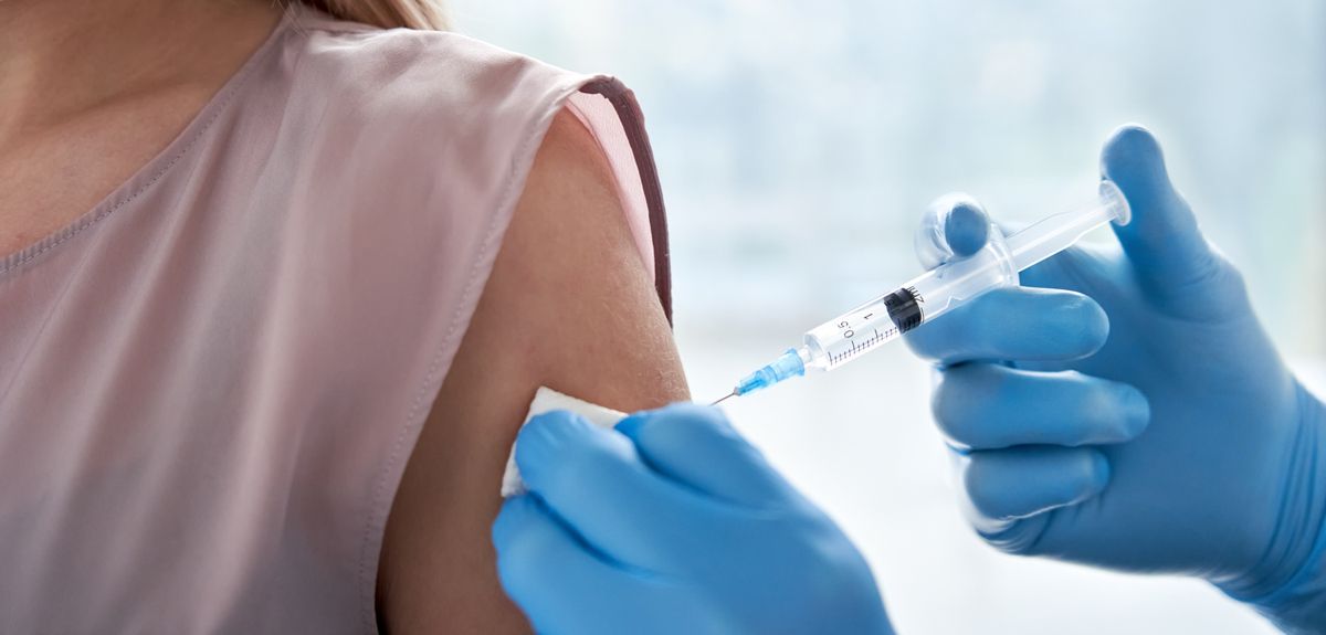 Teenage girl receiving a vaccine