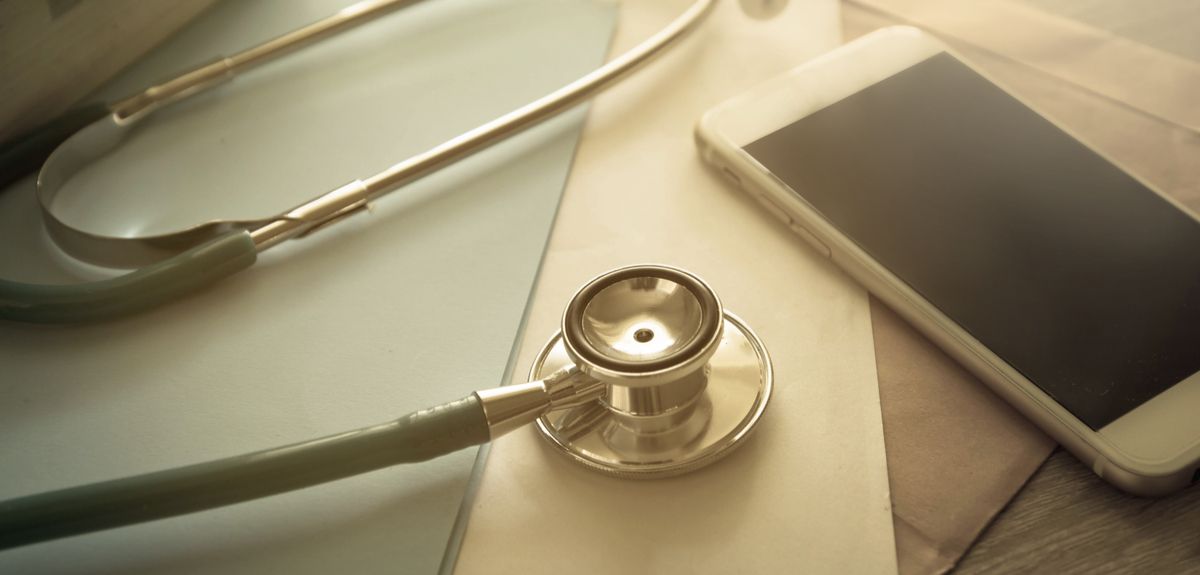 Photo | Mobile phone next to a stethoscope