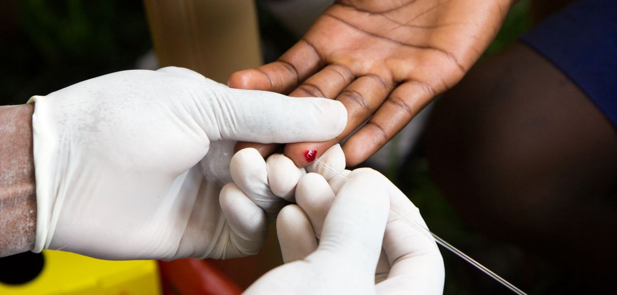 Healthcare worker testing someone for HIV