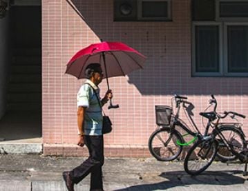 Man with sun parasol