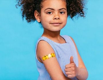 Young girl with plaster on arm