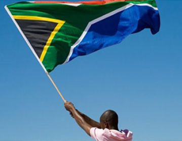 man holding South African flag