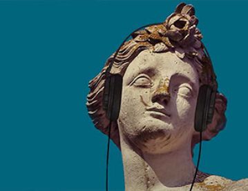 Classical statue with headphones