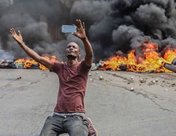 Haitian infront of fire