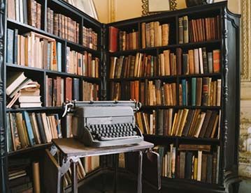 Photograph of typewriter and bookshelf