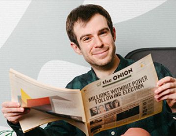Man reading The Onion