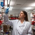 Oxford coronavirus vaccine researcher Katie Ewer inspects samples in the lab