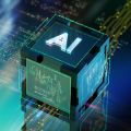 Abstract image showing a 3D cube with the word ‘AI’ against a background of computer code and computer chip designs. 
