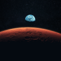 A view of the Earth in space, with the rim of the planet Mars in the foreground. Image credit: Shutterstock.