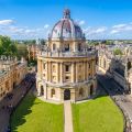 An aerial image of the Radcliffe Camera, an ornate cylindrical building in Oxford topped with a dome. Image credit: Shutterstock.