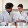 A young male and female researcher in a laboratory. Image credit: Shutterstock.