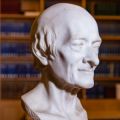 A photograph of a bust of Voltaire