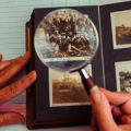Photograph album with a magnifying glass