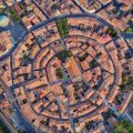 Aerial top view of Bram medieval village architecture and roofs in Southern France