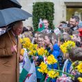 HRH Prince Charles is greeted by 60 primary school children from three Welsh schools at Jesus College. Image by John Cairns