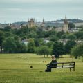 A view from Oxford from South Park, with a person sat on a bench
