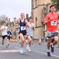 Runners taking part in the Bannister Community Mile through the streets of Oxford