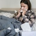 Sick student on bed with flu