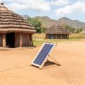 Solar panel providing electricity to dwellings in rural Africa