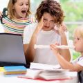 Working mother struggling to work with children at home