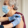 Photo | Elderly woman receiving a vaccination